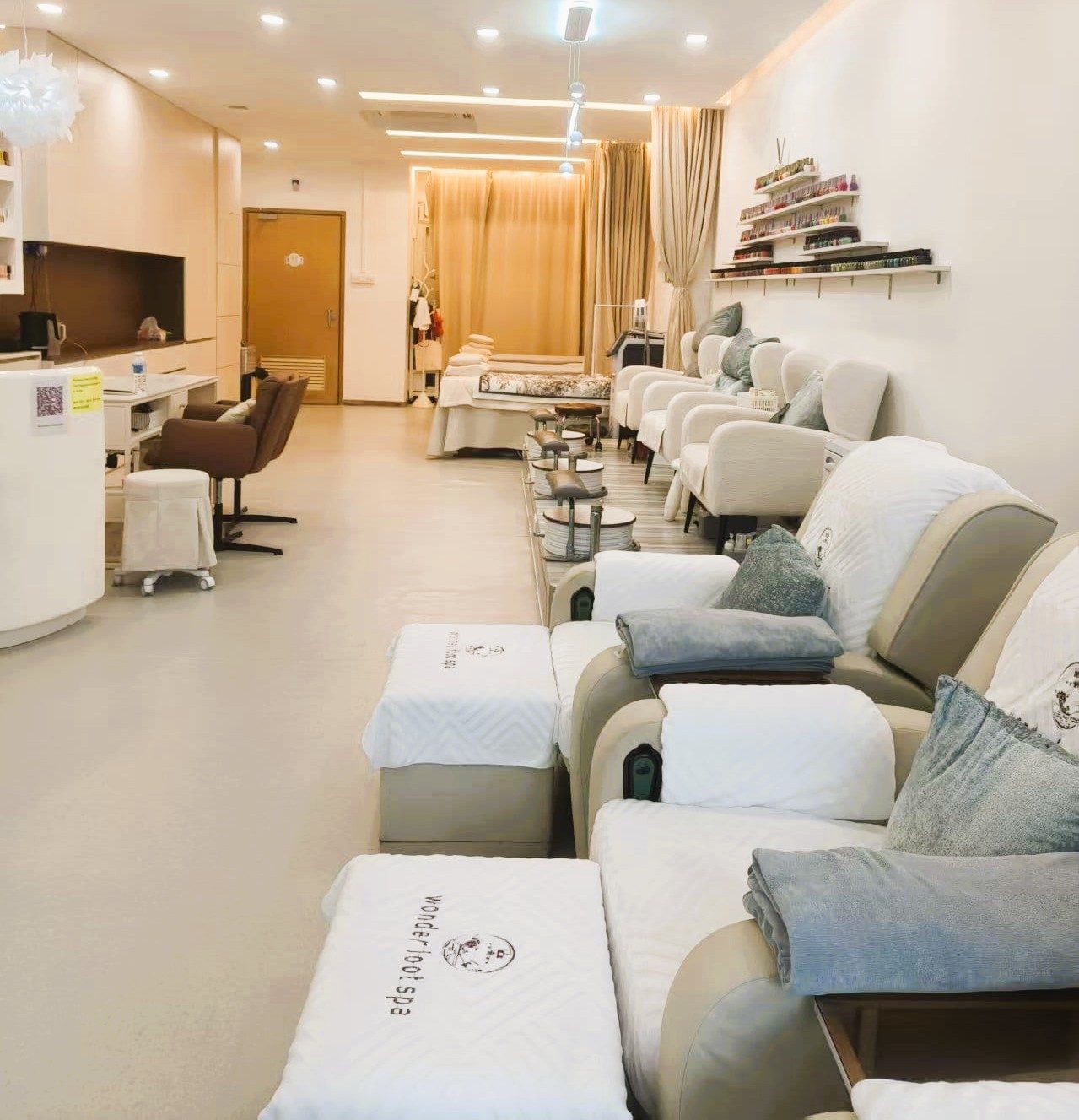 The pedicure floor with spa chairs in a row